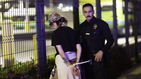 Journalist Mel Buer is detained by police while covering a protest on Aug. 8, 2025. Buer was one of multiple journalists detained or assaulted by the Los Angeles Police Department that day.
