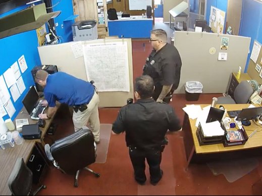 Screenshot from surveillance video taken from Marion, Kansas County police raid on the Marion County Record newsroom.