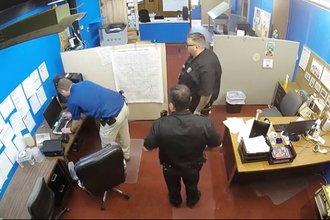Screenshot from surveillance video taken from Marion, Kansas County police raid on the Marion County Record newsroom.