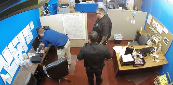 Screenshot from surveillance video taken from Marion, Kansas County police raid on the Marion County Record newsroom.