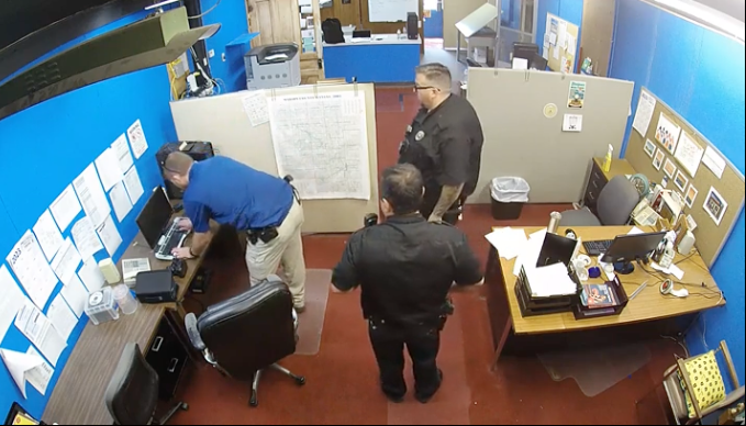 Screenshot from surveillance video taken from Marion, Kansas County police raid on the Marion County Record newsroom.