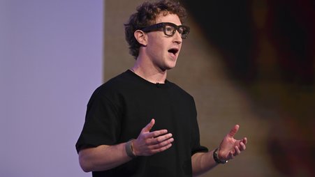 Mark Zuckerberg speaks at a conference while wearing smart glasses.