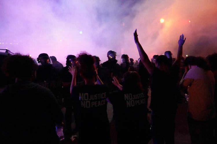 Tear gas is deployed into a Louisville, Kentucky, crowd on May 29, 2020. Several WLKY News crews reported being assaulted by protesters that evening. REUTERS/BRYAN WOOLSTON