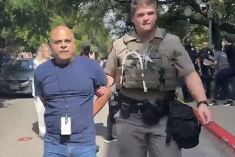 A screenshot from a video taken during the arrest of KTBC broadcast photographer Carlos Sanchez while he was filming a pro-Palestinian protest at the University of Texas at Austin on April 24, 2024.