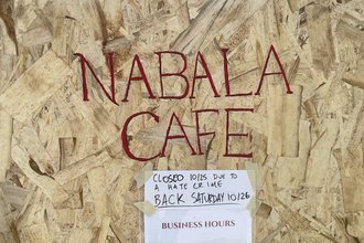 Boarded up windows outside Nabala Cafe on Oct. 25, 2024