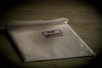 A white envelope stamped "TOP SECRET"