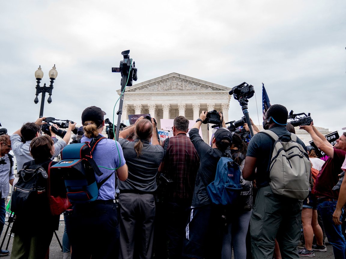 Media covers a protest in front of the Supreme Court (Photo by Stefani Reynolds)