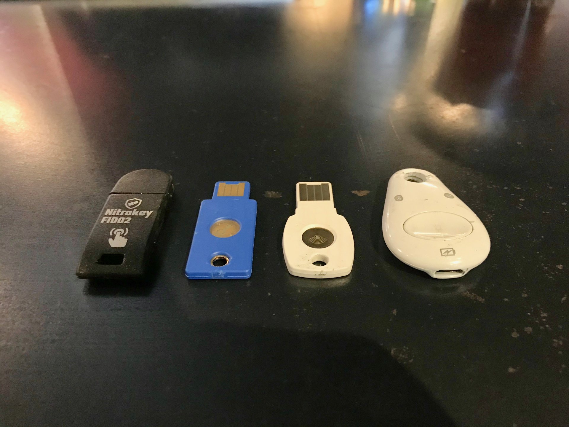 Photo of the four security keys used in testing after the tire test