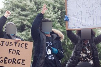 Header image of three protesters holding up signs in recognition of the movement for black lives, each with their faces blurred out of the photo.
