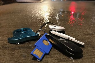 Security keys on a cold, wet NYC sidewalk