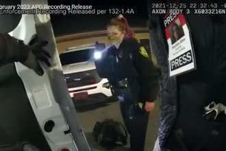 Body camera footage showing Asheville Blade journalist Matilda Bliss' press pass during their arrest