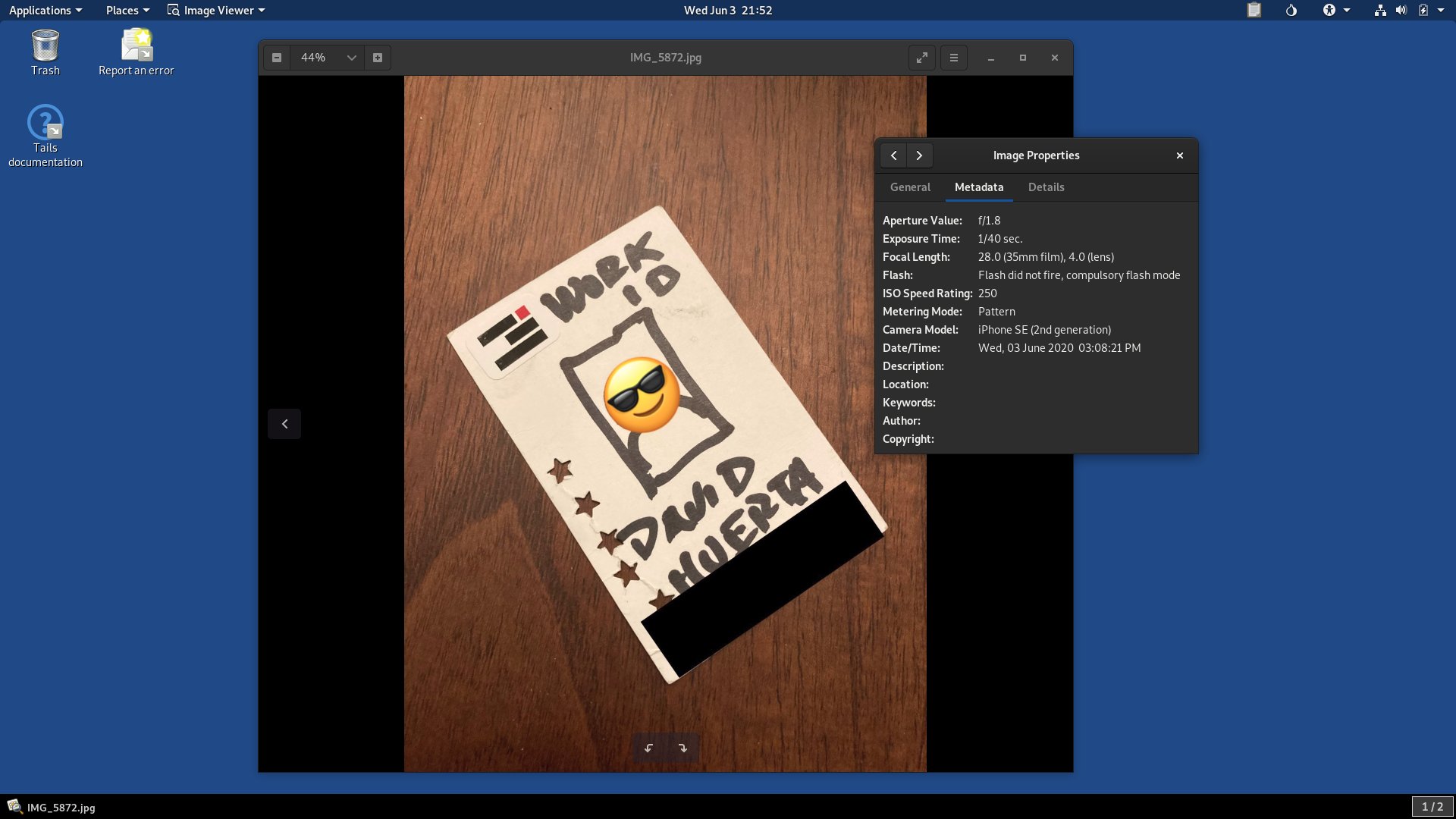 A screenshot of a redacted photo's metadata in Tails OS.